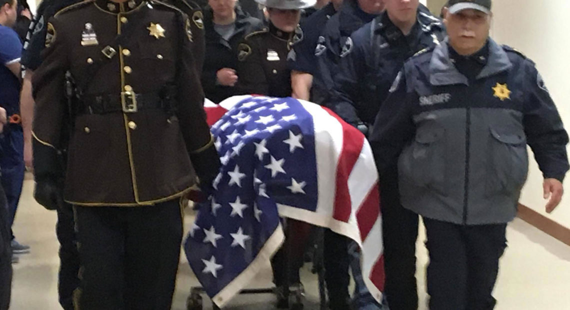 Law enforcement escort body of Pierce County Sheriffs Deputy Daniel McCarney, killed in service