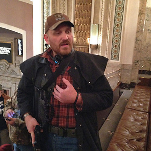 Jason McMillan carrying a firearm in the Washington House gallery in 2015. Beginning in January of 2018, all guns will be banned from the Senate gallery. AUSTIN JENKINS/NORTHWEST NEWS NETWORK