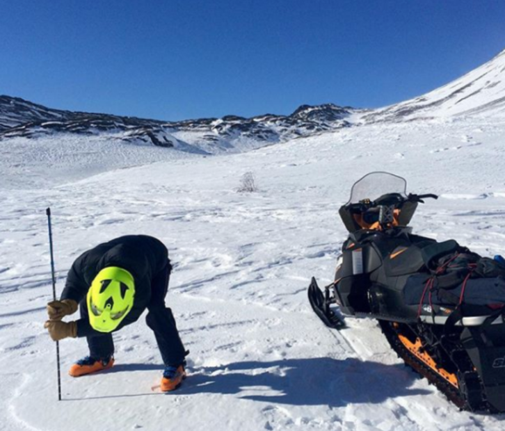 A snow-machine rider takes a snowpack reading as part of Community Snow Observations, a NASA-sponsored citizen science project. CREDIT: OREGON STATE UNIVERSITY