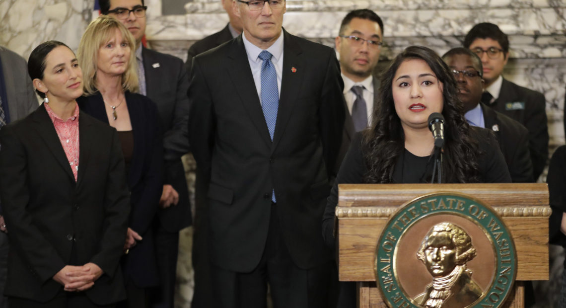 Dulce Gutierrez, right, Assistant Mayor of Yakima, speaks Jan. 5, 2018, during a news conference at the Capitol in Olympia about the need to address voter access in the state.