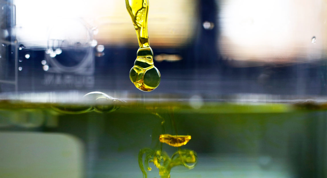 A sample of cannabidiol (CBD) oil is dropped into water. Supplements containing the marijuana extract are popular and widely sold as remedies for a variety of ailments and aches. But scientific evidence that they work hasn't yet caught up for most applications, researchers say. CREDIT: STEFAN WERMUTH