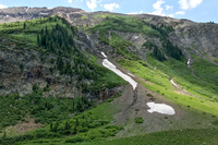 Slivers of snow still hide in coulees near Schofield Pass. A low winter snowpack and high spring temperatures melted most of winter's snow earlier than normal in Colorado's Rocky Mountains. CREDIT: NATHAN ROTT/NPR