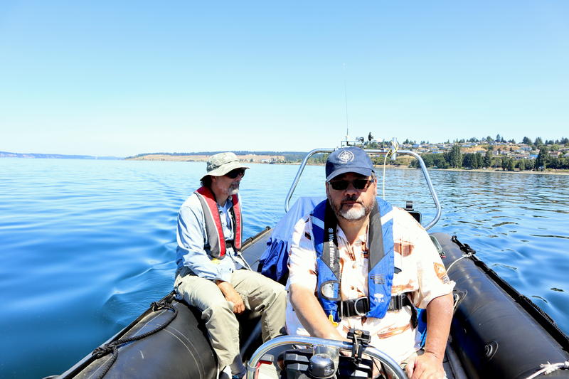 Shipwreck hunters Jeff Groth, right, and Scott Williams methodically towed a magnetometer back and forth over a search grid -- "mowing the lawn," as they called it. CREDIT: TOM BANSE / NW NEWS NETWORK