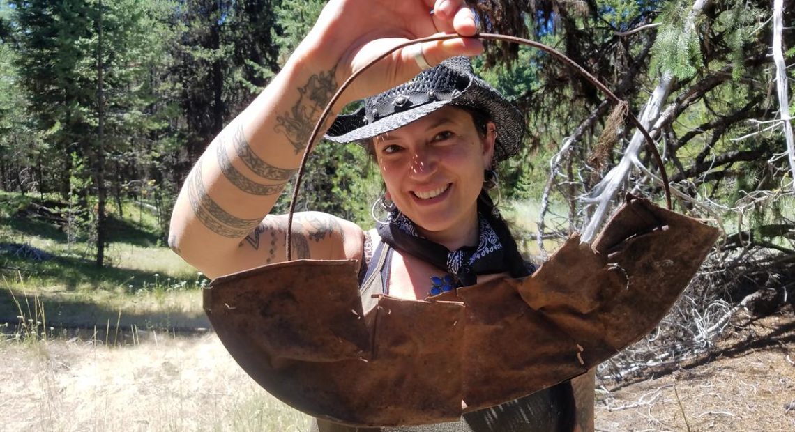 Southern Oregon University archaeologist Chelsea Rose with remnants of a five-part gold pan found during a dig this summer. CREDIT SOUTHERN OREGON UNIV. LABORATORY OF ANTHROPOLOGY