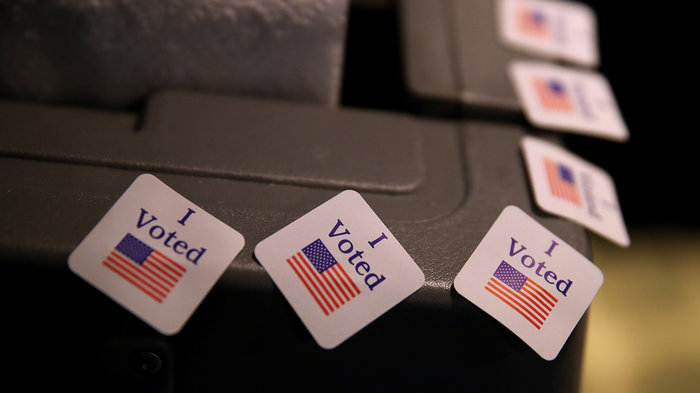 Election officials across the country have worked hard to prioritize security ahead of November's midterms, but some strategies could have the unintended effect of sometimes making voting harder. CREDIT: JUSTIN SULLIVAN