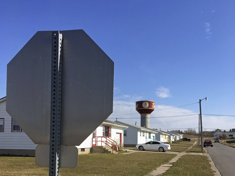 Residential roads with no street name or number signs, such as this one in Belcourt, N.D., are common on the Turtle Mountain Indian Reservation. Under recently tightened state rules, voters in North Dakota are required to present identification with a street address, which is a hurdle for Native Americans. CREDIT: Blake Nicholson/AP