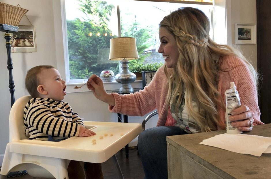 Jocelyn Smith cares for her 11-month-old son, Mason at their home in Camas, Washington, on Wednesday, Jan. 30, 2019. Smith has been afraid to take Mason out of the house during a measles outbreak in southwest Washington because he is too young to receive the measles vaccine. CREDIT: GILLIAN FLACCUS/AP