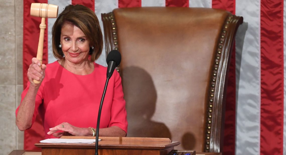 Speaker of the House Nancy Pelosi, D-Calif., holds the gavel after being sworn in on Thursday. CREDIT: SAUL LOEB/AFP/GETTY IMAGES