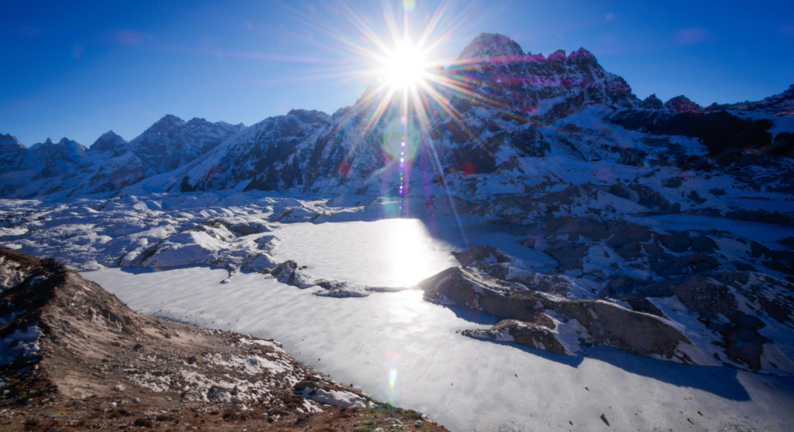 The Ngozumpa Glacier in the Himalayas of Nepal, filling the valley in the foreground, now contains meltwater pools. CREDIT: Whitworth Images/Getty Images