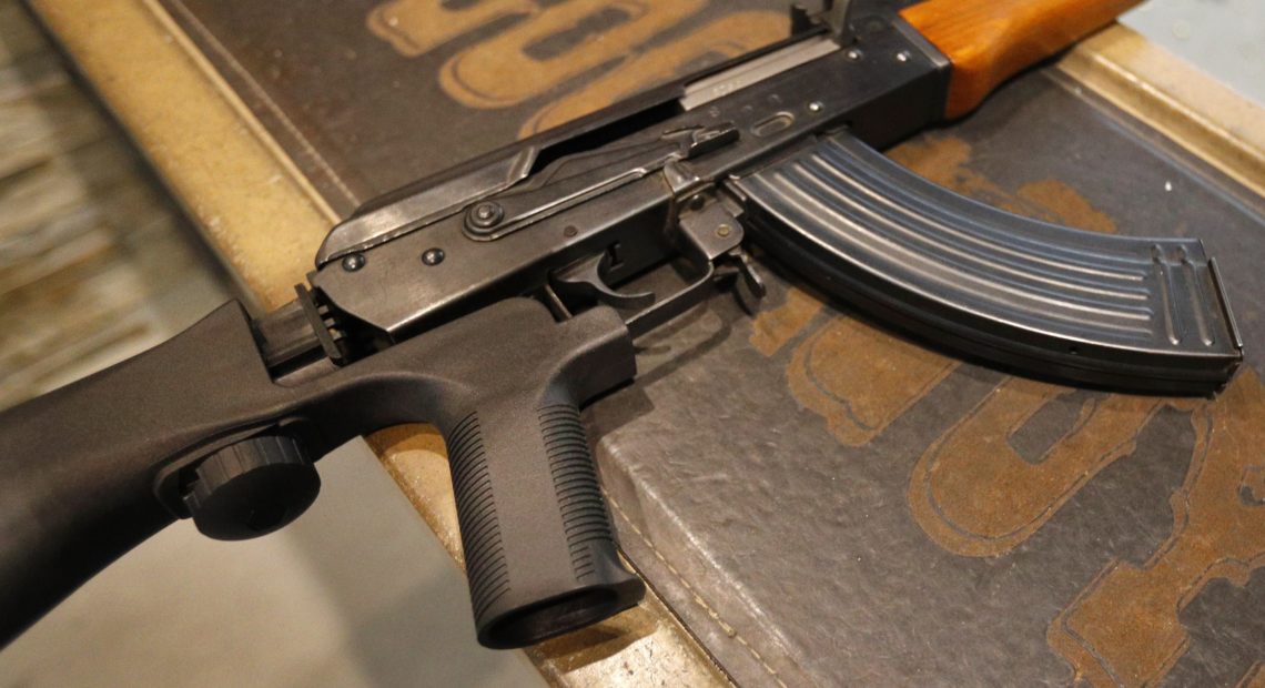 Bump stocks like this one installed on an AK-47 are now illegal in the U.S., after the Trump administration changed how they are legally defined. The devices can allow a semi-automatic rifle to fire nearly as fast as a machine gun. George Frey/Getty Images