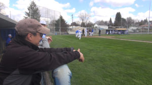 Seshiki watches Colton High School athletes take the field for a baseball game against Orofino High School.