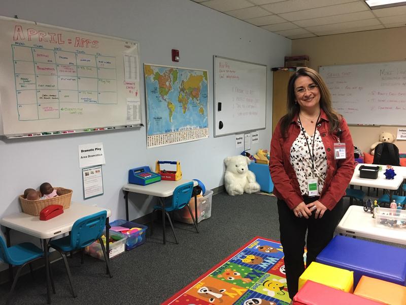 Maria Vasquez stands in the free child care space she oversees in a Department of Social and Health Services office in Yakima. The room has transformed over the past two years into a place where families waiting for state services can take a breather. CREDIT: MAX WASSERMAN/N3