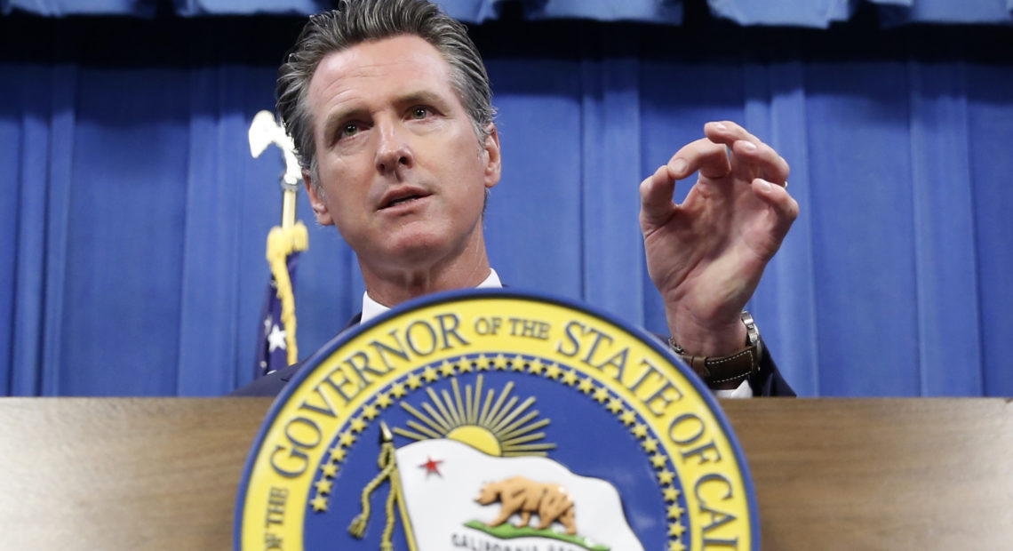 California Gov. Gavin Newsom signed a bill into law Tuesday that would require presidential candidates to release several years of tax returns to be on the primary ballot in the state. Rich Pedroncelli/AP