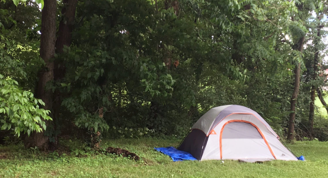 Homeless residents often live outdoors in tents in rural Kentucky. Rarely pitched out in the open, like this one in Lexington, most are hidden in thick bushes of wooded areas. CREDIT: Mary Meehan/WEKU