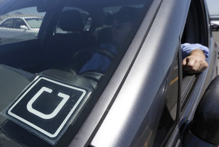 File photo. An Uber car and driver in San Francisco. CREDIT: Jeff Chiu/AP