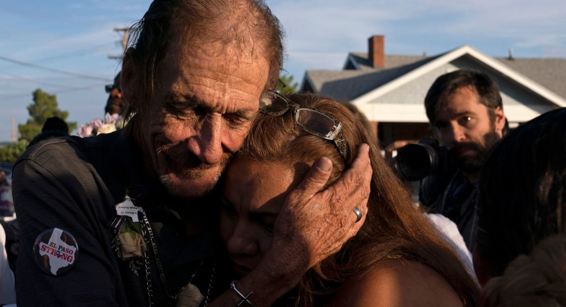 Antonio Basco, husband of El Paso Walmart shooting victim Margie Reckard, hugs an attendee during his wife's visitation service in El Paso, Texas, in August. Paul Ratje/AFP/Getty Images