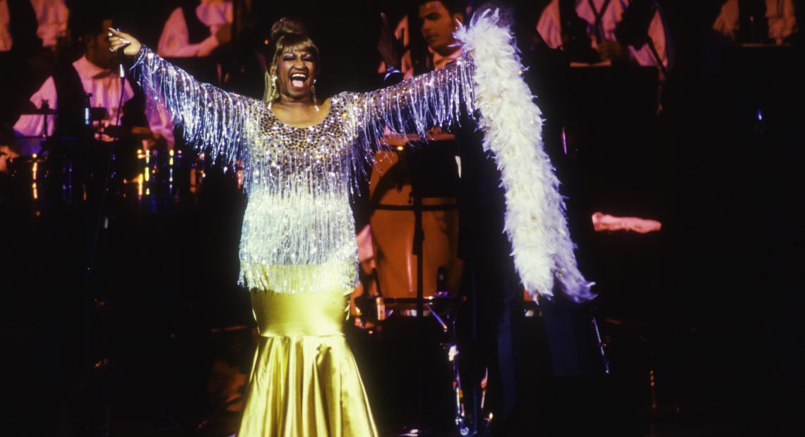 Celia Cruz performs in New York in 1995. That same year, Deborah Paredez saw her at Chicago's Aragon Ballroom. "Cruz opened her mouth, the band lifted their horns and we came together on the dancefloor," she says. Jack Vartoogian/Getty Images/Getty Images