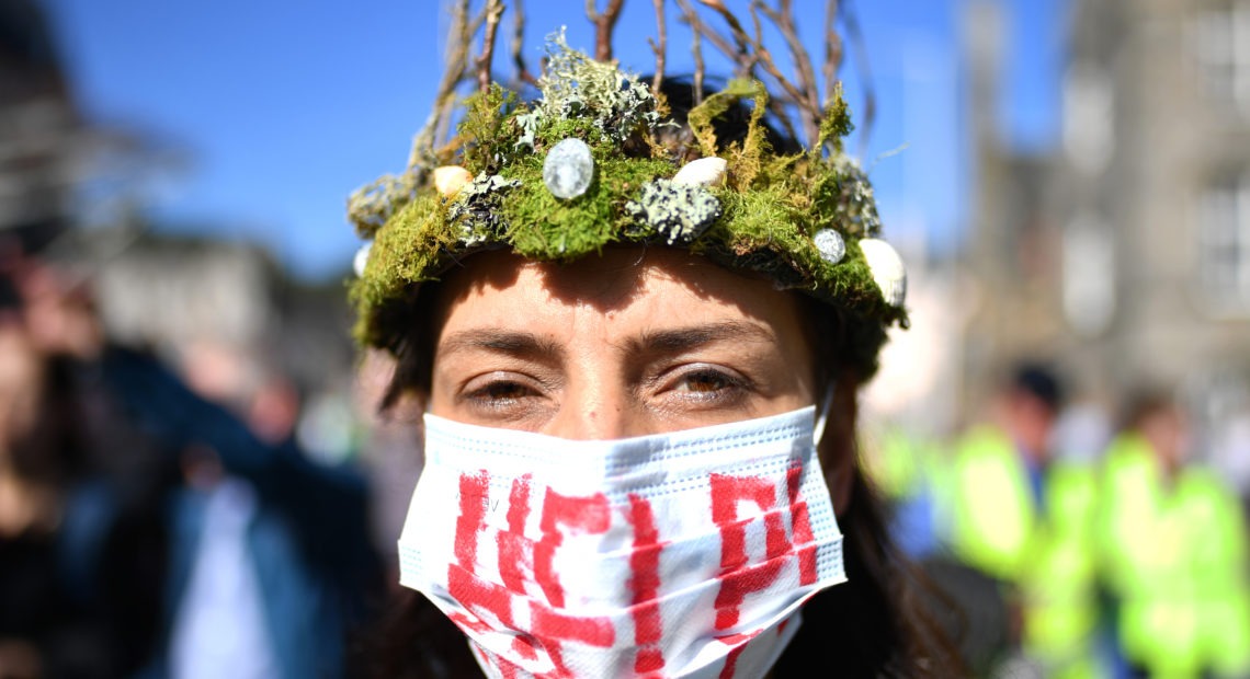 The Global Climate Strike drew scores of protesters around the world Friday, as young people answered a call from activist Greta Thunberg to demand action on climate change. Here, a protester attends a rally in Edinburgh, Scotland. CREDIT: Jeff J Mitchell/Getty Images