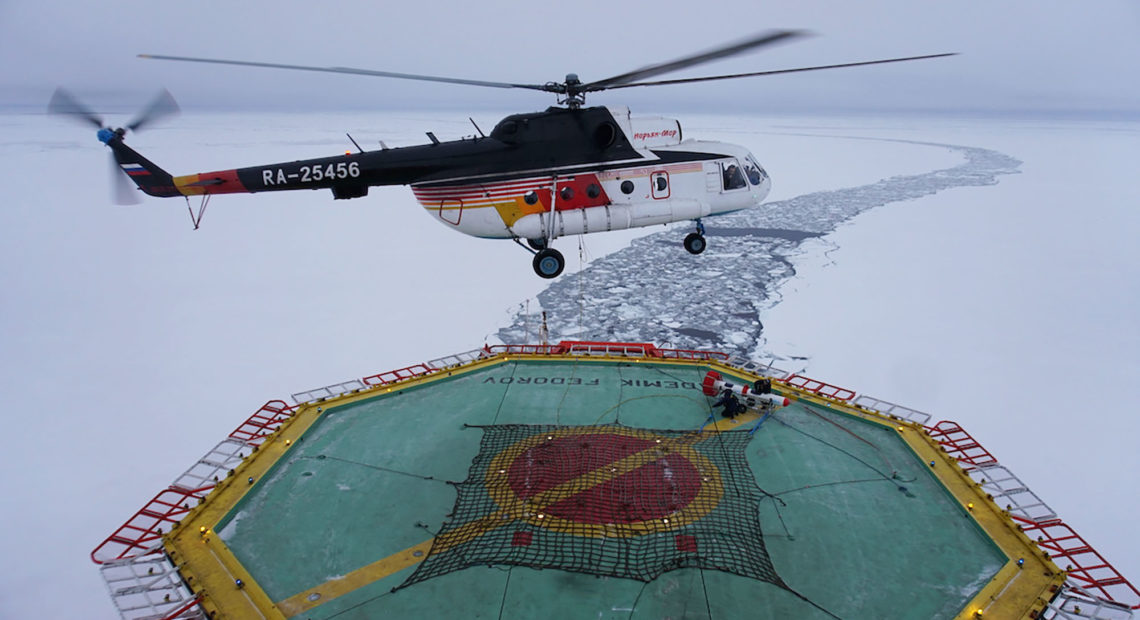 A helicopter takes off from the research vessel Akademik Federov to survey the thickness of an ice floe on Sept. 30. CREDIT: Ravenna Koenig