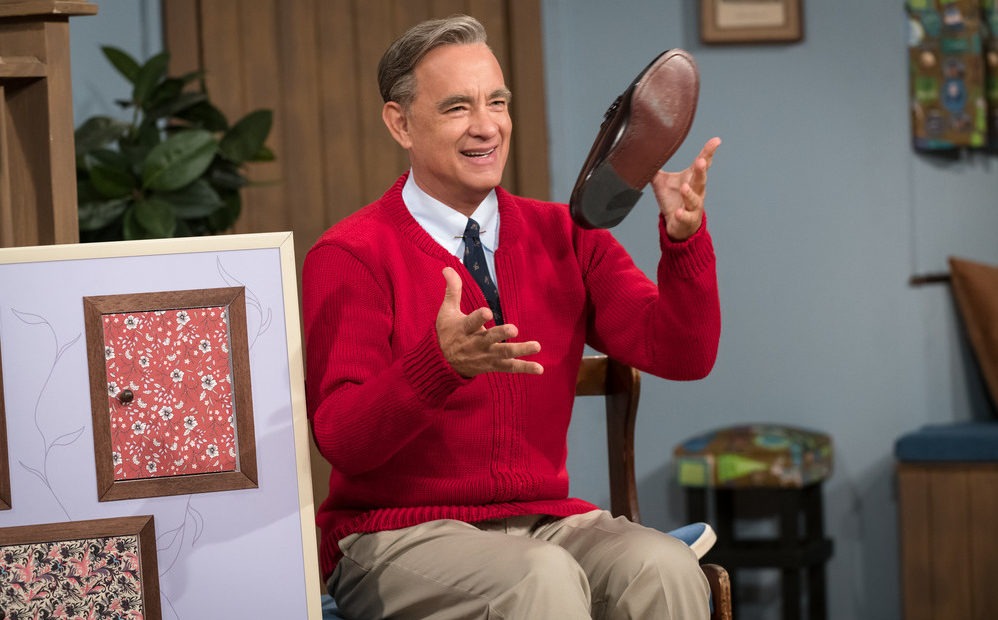 Tom Hanks stars as Fred Rogers in A Beautiful Day in the Neighborhood. Hanks watched a lot of Mister Rogers to research the role and found as an adult, you don't really "get it": "Why is it taking so long? What's the big deal? What are these fish?" CREDIT: Lacey Terrell/CTMG