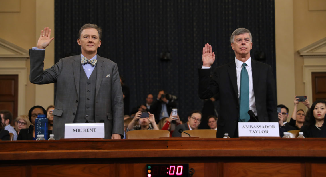 Deputy Assistant Secretary for European and Eurasian Affairs George Kent (left) and top U.S. diplomat in Ukraine William Taylor are sworn in before testifying before the House Intelligence Committee on Capitol Hill on Wednesday. CREDIT: Chip Somodevilla/Getty Images