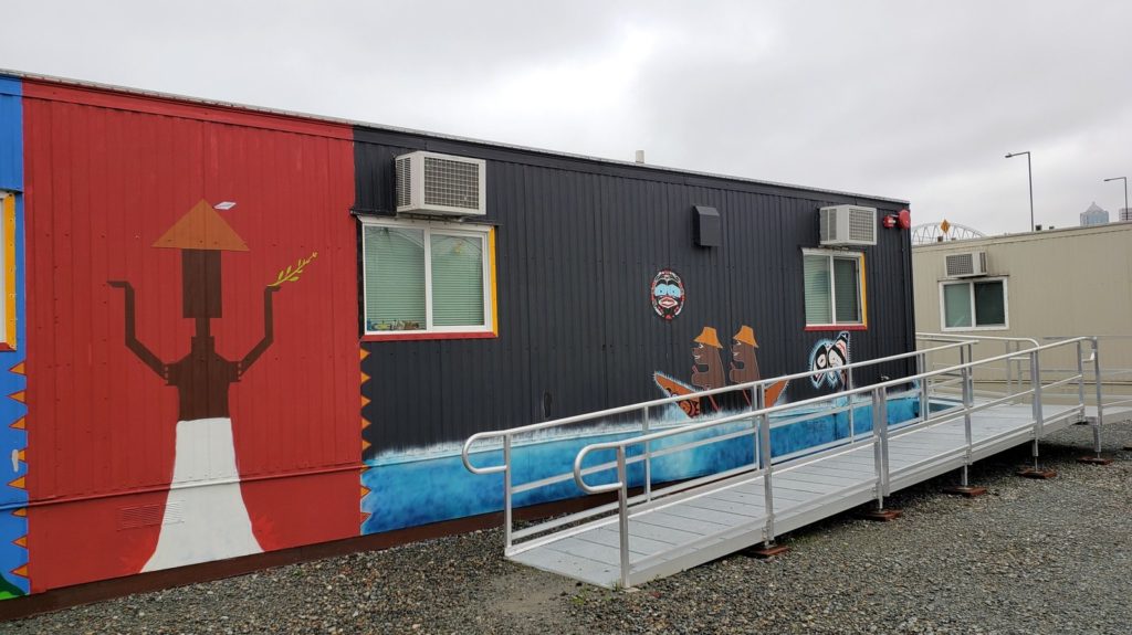 Residents are painting the exterior of each trailer in Eagle Village with Native imagery. CREDIT: Casey Martin/KUOW