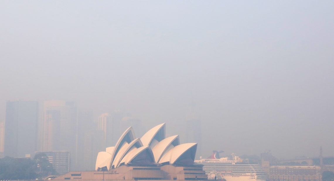 Much of New South Wales, Australia, including the Sydney Opera House, lay under a shroud of smoke Thursday. The state remains under severe or very high fire danger warnings as more than 60 fires continue to burn within its borders. CREDIT: Cassie Trotter/Getty Images