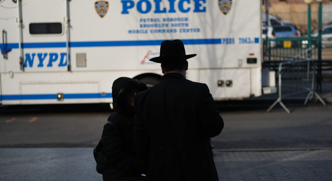 People walk through the Orthodox Jewish section of a Brooklyn neighborhood last month. Tensions remain high in Jewish communities following a series of attacks and incidents in recent weeks. CREDITS: Spencer Platt/Getty Images