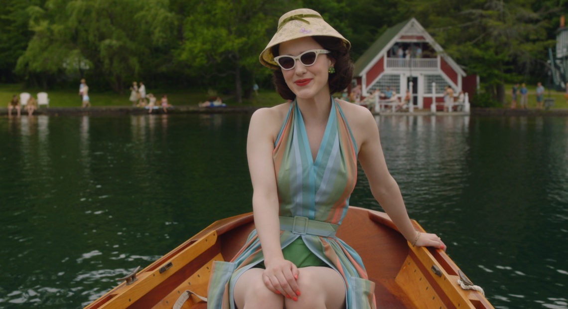 In the second season of The Marvelous Mrs. Maisel, Midge (Rachel Brosnahan) visits the Catskills. Costume designer Donna Zakowska says this outfit "in the boat with a funny lampshade hat" was among her favorites. CREDIT: Amazon Studios