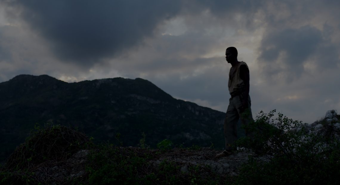 The story of a man (Mackenson Bijou) who was brought back from the dead casts a long shadow into the present in Zombi Child. CREDIT: Film Movement