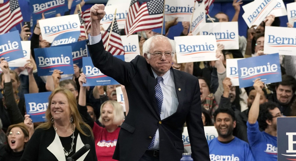 Democratic presidential candidate Sen. Bernie Sanders takes the stage during a primary night event on Tuesday in Manchester, N.H. Drew Angerer/Getty Images