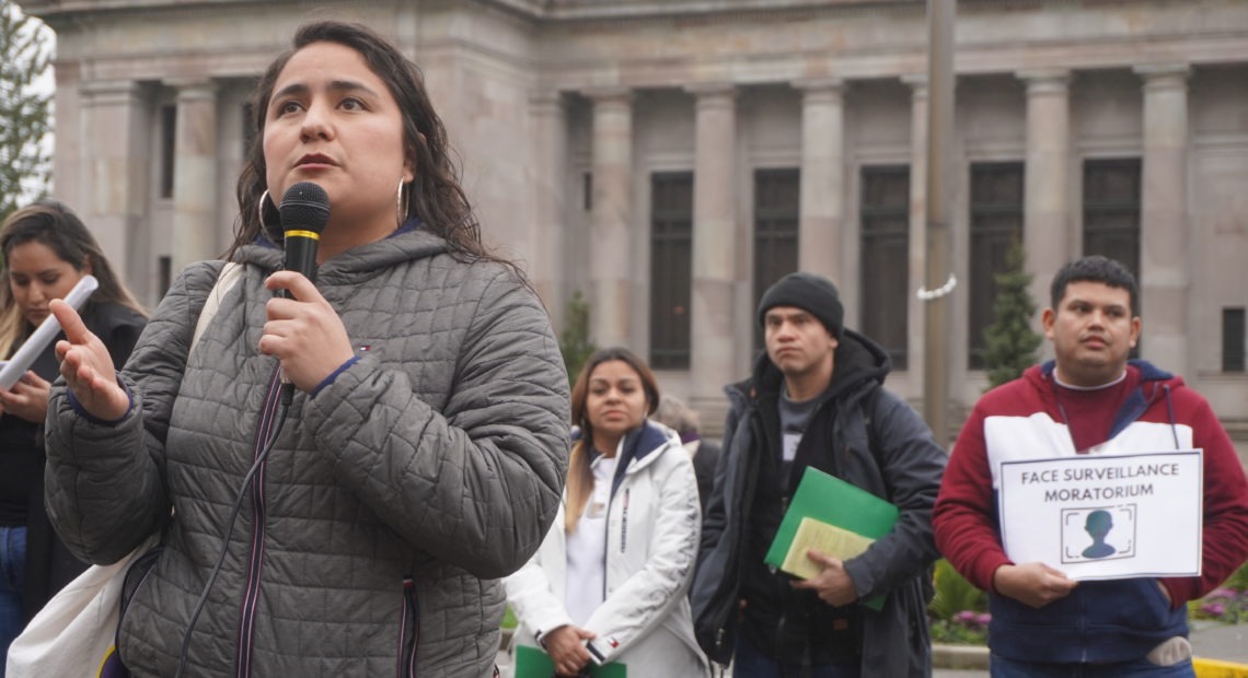 Former Yakima City councilmember Dulce Gutiérrez spoke to other immigrant rights advocates gathered on the steps to the state capitol as undocumented residents Wendy, Saul and Jorge listened from behind.