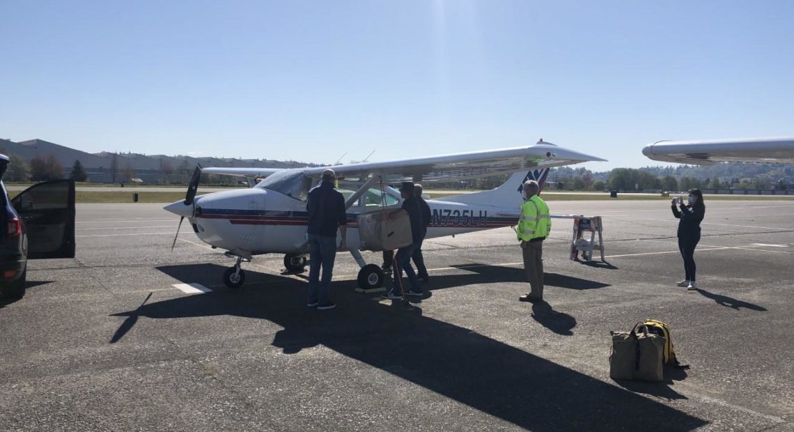 Volunteers flew 300,000 imported masks from China to smaller hospitals in Washington. CREDIT: Tim Pfarr/Washington State Hospital Association