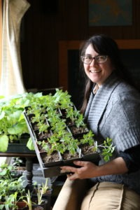 Ramella holding a row of green plants