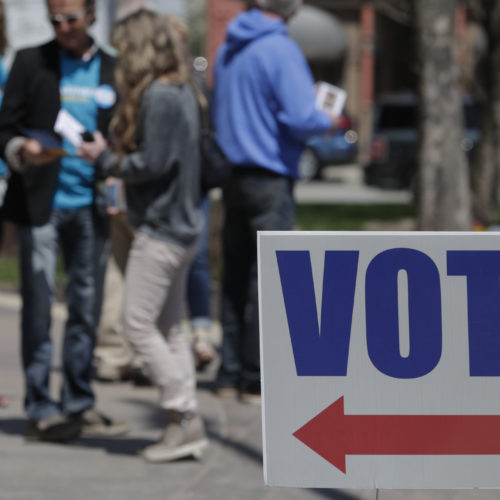 Electioneers greet voters outside the Hamilton County Government Center