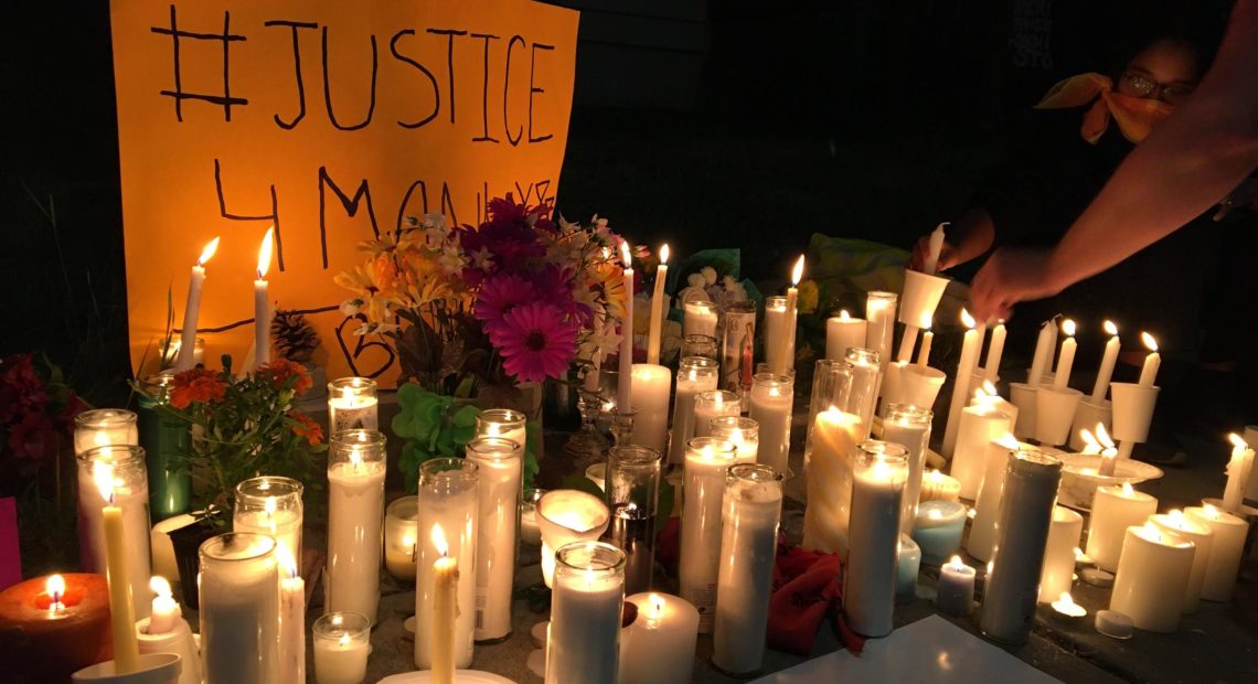 Hundreds gathered at a vigil Wednesday night to remember Manuel Ellis, who died March 3 in the custody of Tacoma police officers. His death has been ruled a homicide by the Pierce County medical examiner, and the officers have been placed on leave. CREDIT: Will James/KNKX