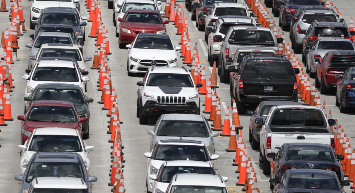 Cars line up for coronavirus testing outside Hard Rock Stadium in Miami Gardens, Fla. Florida is one of many states reporting spikes in COVID-19 cases in recent days, as the number of confirmed cases worldwide has topped 10 million. Wilfredo Lee/AP