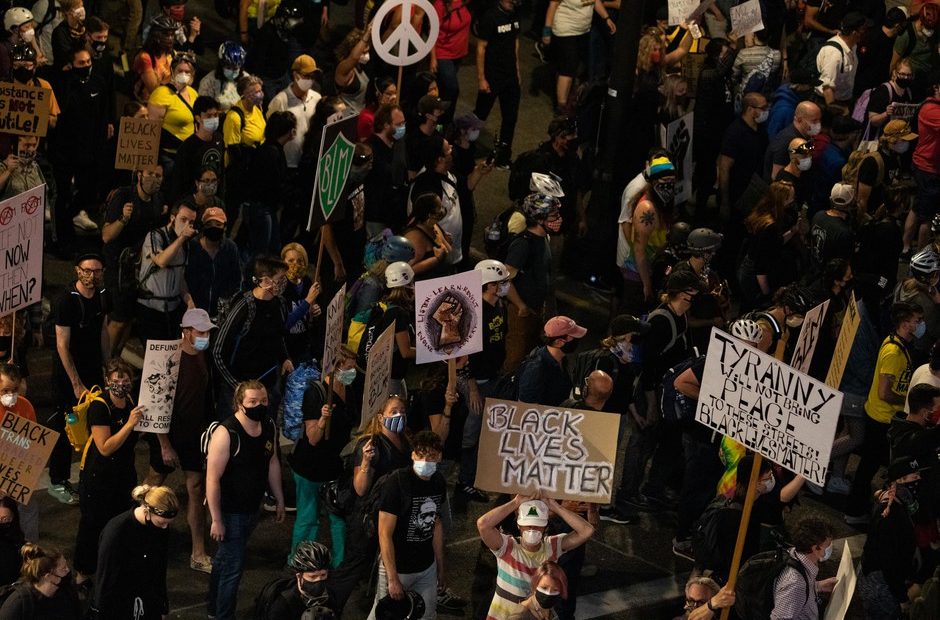 A subsection of the crowd marches toward the Marriott hotel in downtown Portland, Ore., July 25, 2020. Portland has sustained protests against police brutality and systemic racism for 58 days. CREDIT: Bradley W. Parks/OPB