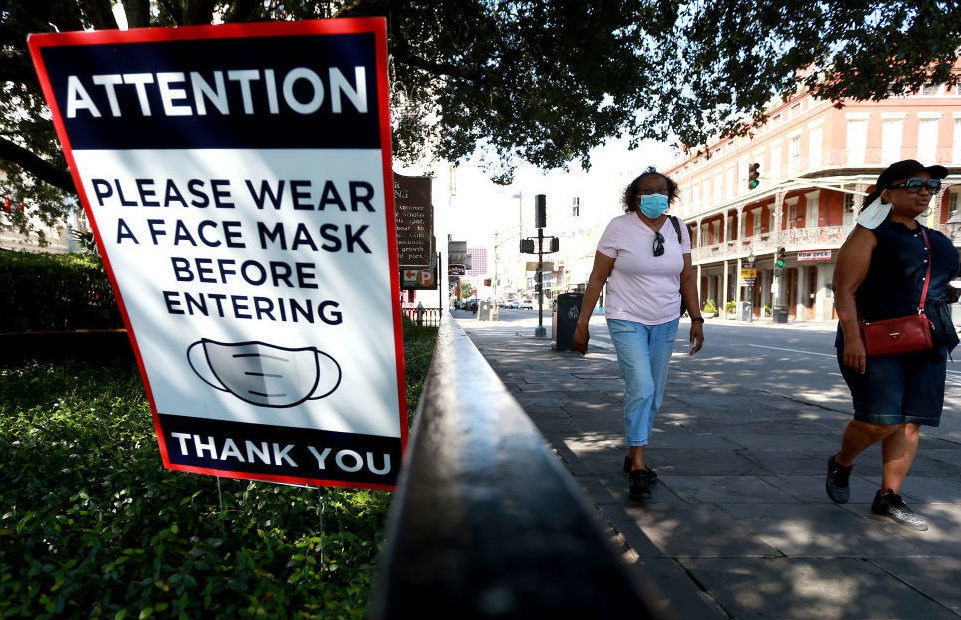 Scientists estimate that near-universal mask use could make a major difference in bringing down coronavirus infections in the United States. Sean Gardner/Getty Images