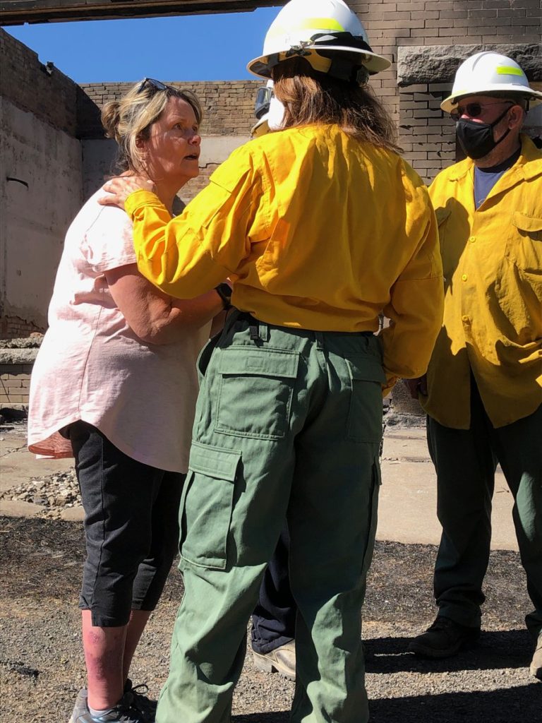 Washington public lands commissioner Hilary Franz toured Malden on Wednesday, Sept. 9, with Mayor Chris Ferrell. Whitman County Sheriff Brett Myers joined and recounted the frantic evacuation just two days earlier. CREDIT: Doug Nadvornick/SPR