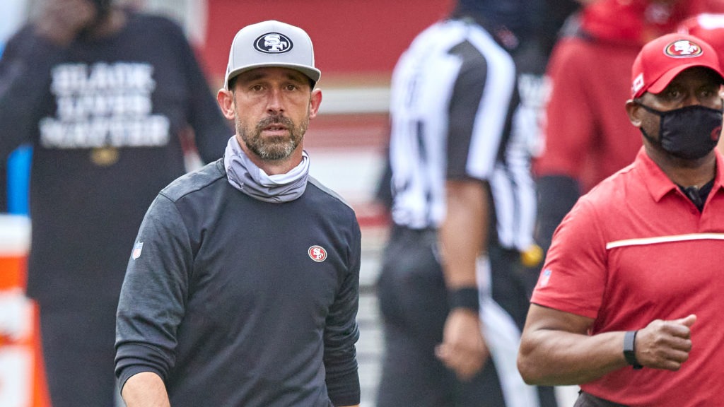 The NFL has fined San Francisco 49ers head coach Kyle Shanahan and two other coaches for not following rules about keeping their faces covered. Here, Shanahan walks off the field after his team's Sept. 13 game against the Arizona Cardinals. MSA/Icon Sportswire via Getty Images