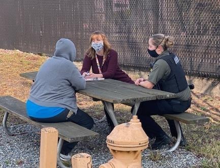 Compass Health program manager Marla Johns, center, and Skagit County Detective Anne Weed, right, collaborated to embed mental health clinicians with deputies responding to relevant 911 calls.