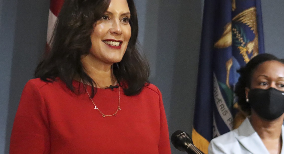 Michigan's Supreme Court ruled Friday that Democratic Gov. Gretchen Whitmer (pictured here on Sept. 16) does not have the authority to extend a state of emergency past April 30. Whitmer had cited two state laws that allowed her to maintain the state's coronavirus measures via executive order. CREDIT: AP