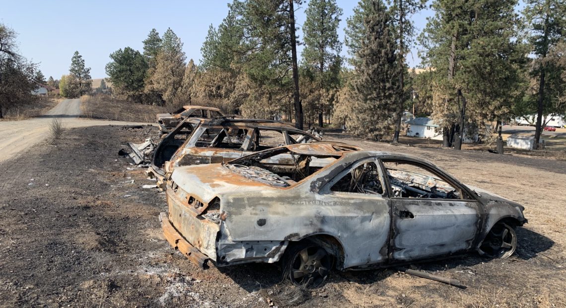 Burned cars from a wildfire that destroyed most of the eastern Washington town of Malden on Labor Day. Kirk Siegler/NPR