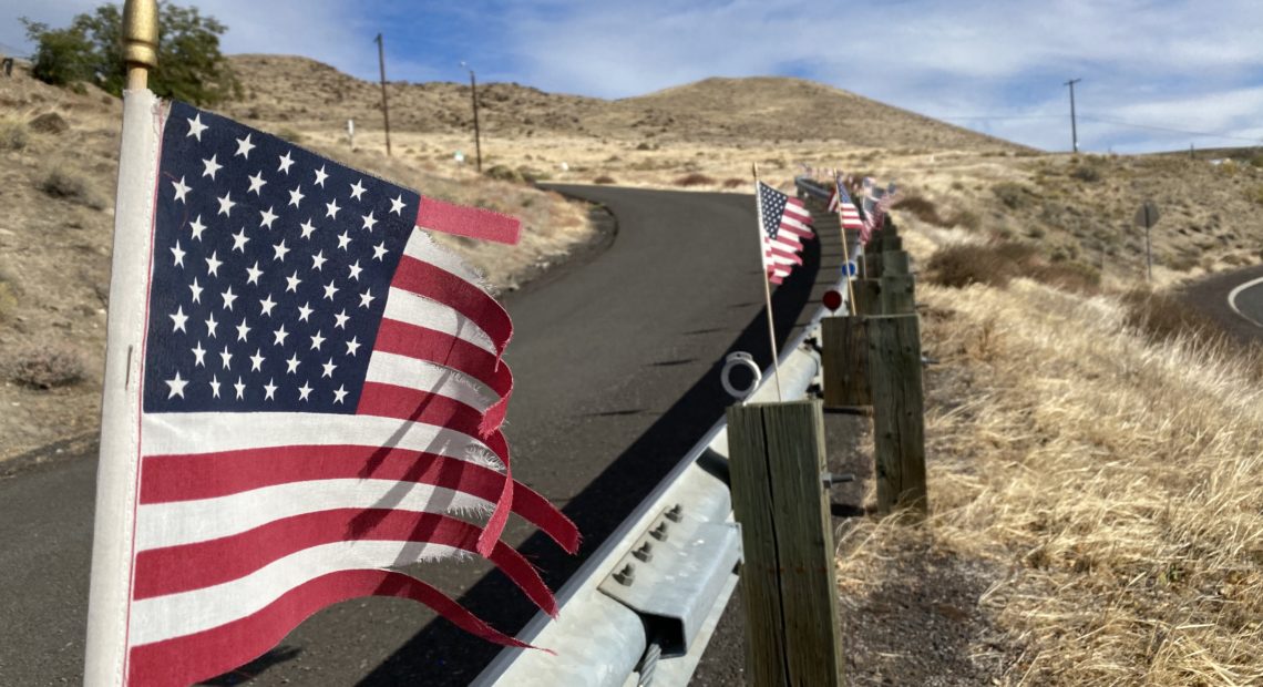 Tattered American flags wave in the strong wind of the Columbia River Gorge National Scenic Area on October 27, 2020. CREDIT: Anna King/N3