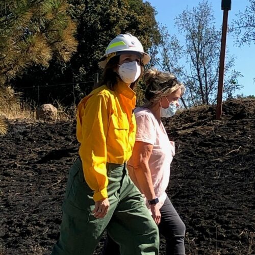 Washington Lands Commissioner Hilary Franz, walking here with former Malden Mayor Chris Ferrell, is working with legislators to find more money for wildfire suppression and prevention. CREDIT: Doug Nadvornick/SPR