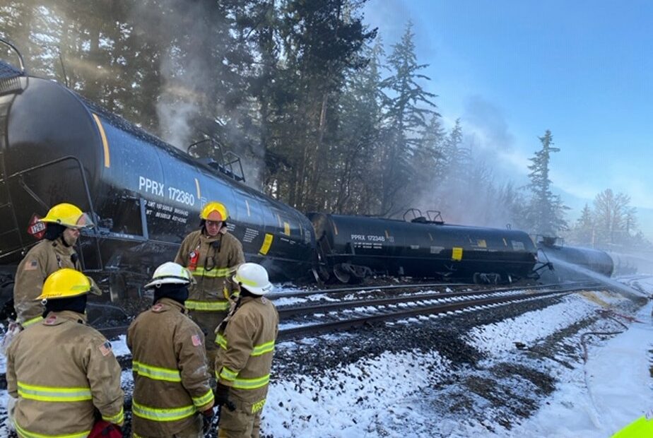 Fire crews respond to the scene of a derailed train in the city of Custer, Washington, in Whatcom County on Tuesday, December 22, 2020. A BNSF spokesperson said seven train cars derailed and two caught fire. CREDIT: Washington Dept. of Ecology