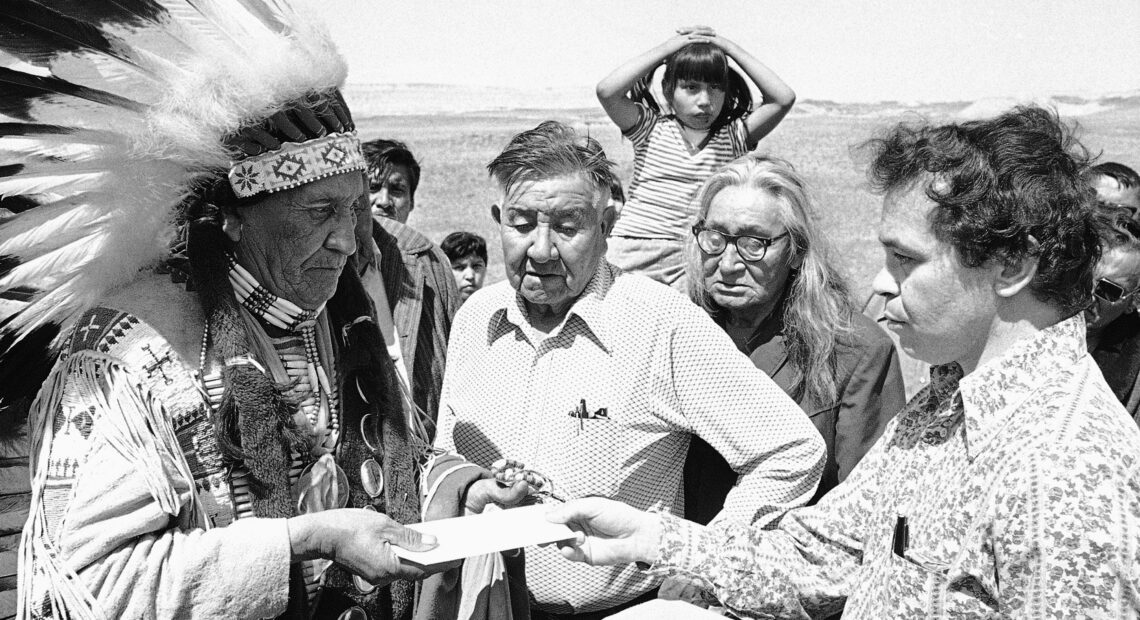 Hank Adams, right, died Dec. 21 at the age of 77. Adams fought for Native American treaty rights throughout his life. CREDIT: Anonymous/AP