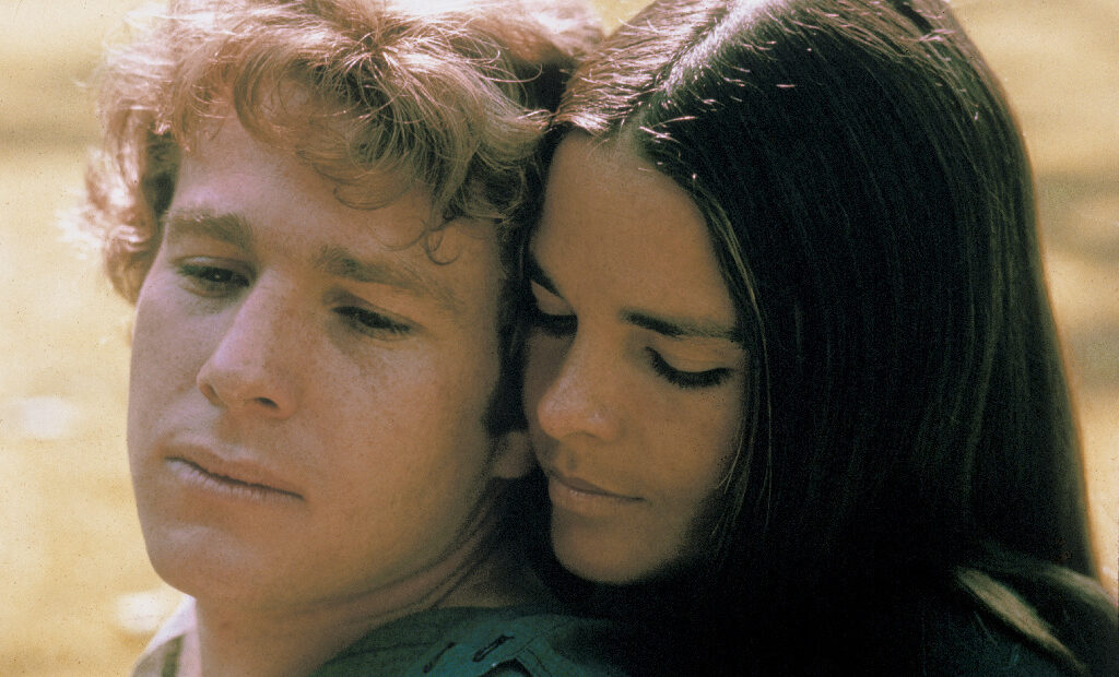 Ryan O'Neal and Ali MacGraw starred in Love Story — a romantic tearjerker that became the highest grossing movie of 1970. Since then, it has inspired countless ugly cries — and plenty of parodies, too. Paramount Pictures