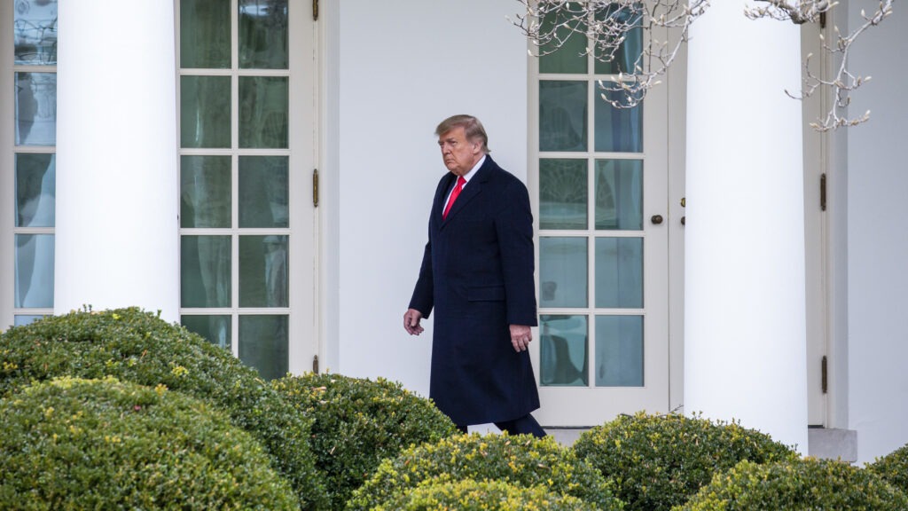 President Trump walks outside the White House